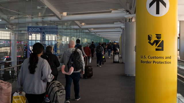 Photo: people queueing at US customs and borders controls